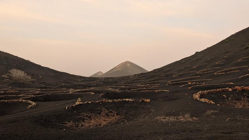 Man made craters in volcanic soil in Lanzarote, Spain called Chupaderos that are used to grow grapes in the dry climate of the island.