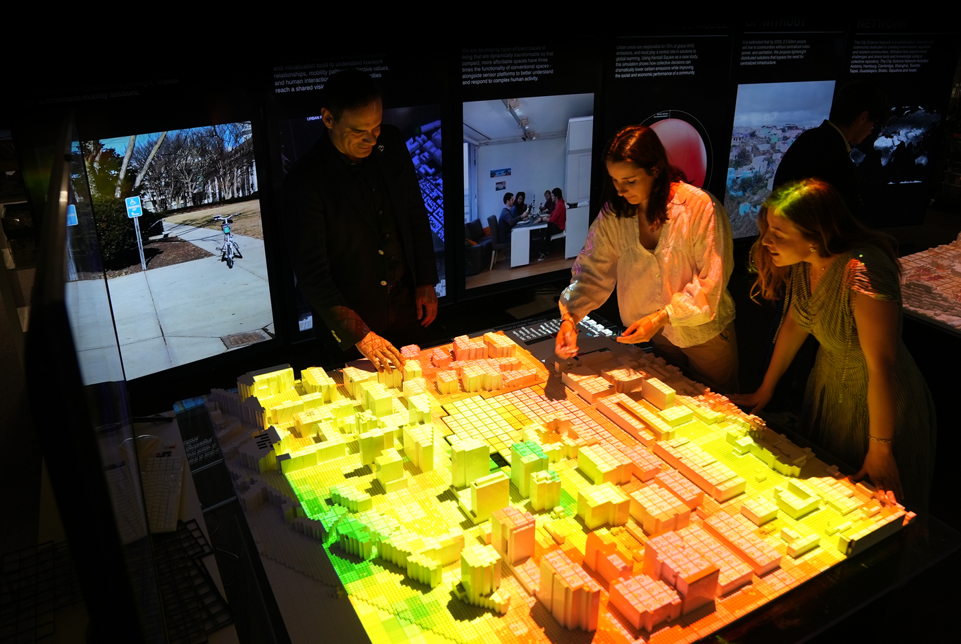 Rebuilding Kendall Square one block at a time: on City Science's CityScope table, every move updates a live simulation of how the community could perform.